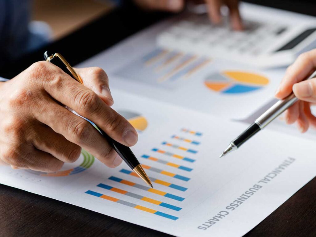 Two people reviewing a business valuation chart